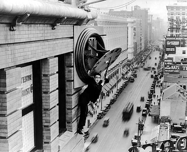 grayscale photograph of man standing on side building, architecture, monochrome, building, Harold LLoyd, men, movies, street, actor, Safety Last!, vintage, clock tower, clocks, dials, car, rooftops, old photos, skyscraper, traffic, motion blur, classic car, bricks, screen shot, people, Los Angeles, USA, tram, utility pole, HD wallpaper HD wallpaper