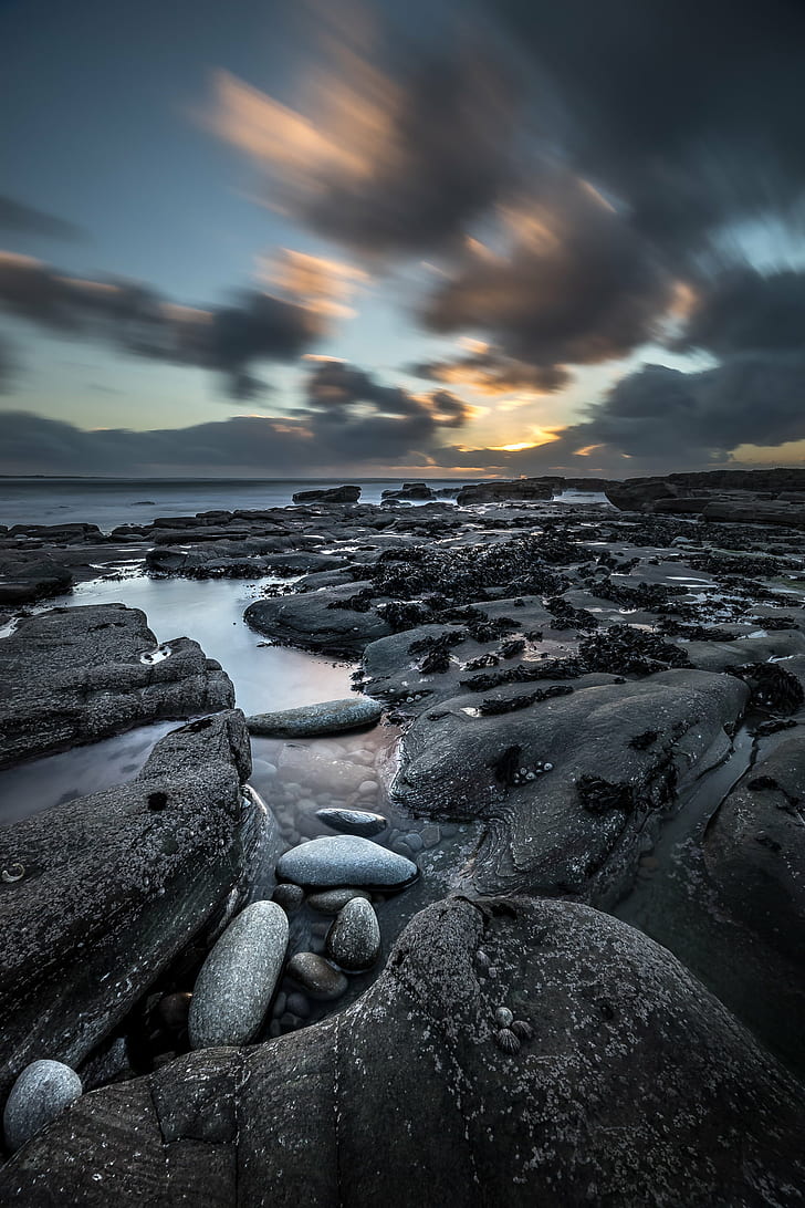 selective focus photography of gray stones near body of water, liscannor, ireland, liscannor, ireland, Liscannor, Ireland, Seascape, photography, selective focus, body of water, photo, landscape, fullframe, a7, blu, sony, light, rocks, orange, clouds, sunset, long exposure, ultra, travel, motion  photography, sony a7, sky  europe, geotagged, sea, Clare, IE, nature, rock - Object, beach, water, dusk, sky, outdoors, scenics, coastline, HD wallpaper
