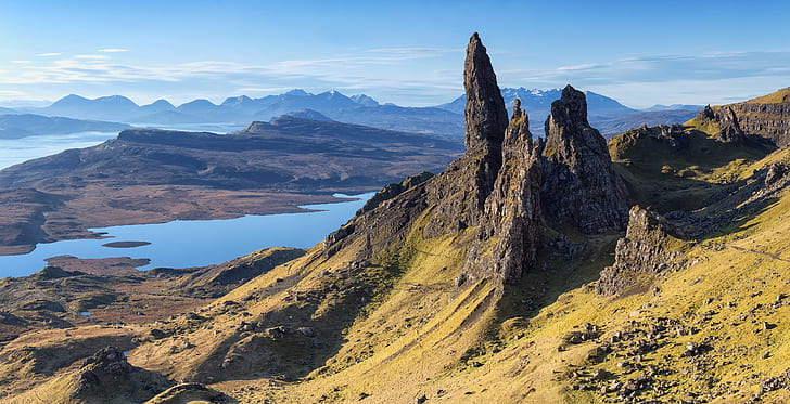 brown concrete mountain in middle of grassfield under blue and white sunny sky during daytime, Old Man of Storr, concrete, mountain, middle, blue and white, daytime, Scotland, Isle of Skye, pinnacles, Landscape, nature, mountain Peak, scenics, outdoors, lake, travel, summer, rock - Object, sky, tourism, famous Place, beauty In Nature, hiking, blue, european Alps, dolomites, HD wallpaper