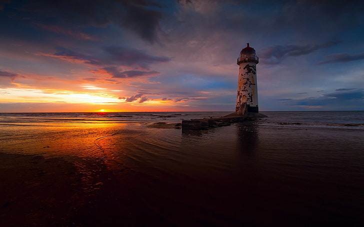 landscape photography of lighthouse during sunset, beach, sunset, sea, lighthouse, HD wallpaper