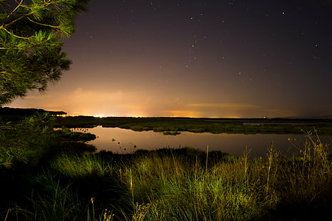 body of water between green grass field during night time, City lights, body of water, green grass, grass field, night time, long exposure, luci, citta, notte, stagno, lights at night, city  lights, light  night, amazing, beautiful, stars, stelle, star - Space, night, nature, astronomy, sky, galaxy, landscape, dusk, reflection, sunset, lake, milky Way, scenics, HD wallpaper HD wallpaper