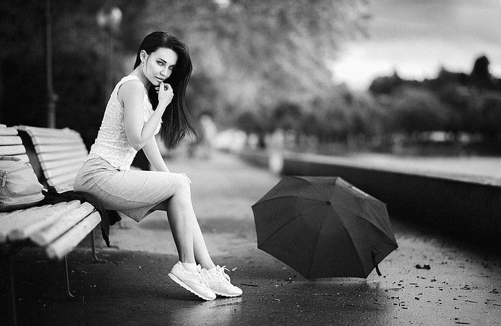 grayscale photography of woman in white tank top and white skirt sitting on white bench, women, brunette, black hair, monochrome, umbrella, skirt, bench, women outdoors, sneakers, side view, depth of field, white tops, sitting, Angelina Petrova, Marco Gressler, HD wallpaper