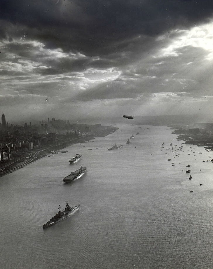 parade, photography, sun rays, clouds, cityscape, 1945, Zeppelin, United States Navy, skyscraper, ship, old photos, history, historic, portrait display, monochrome, vintage, river, Battleship, New York City, Hudson River, USA, HD wallpaper