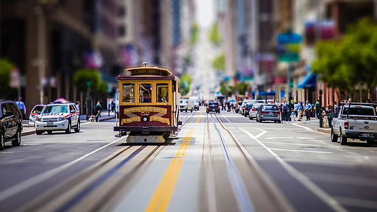 maroon and brown tram, yellow train in city during daytime, street, car, road, city, tilt shift, cityscape, San Francisco, tram, blurred, building, HD wallpaper HD wallpaper