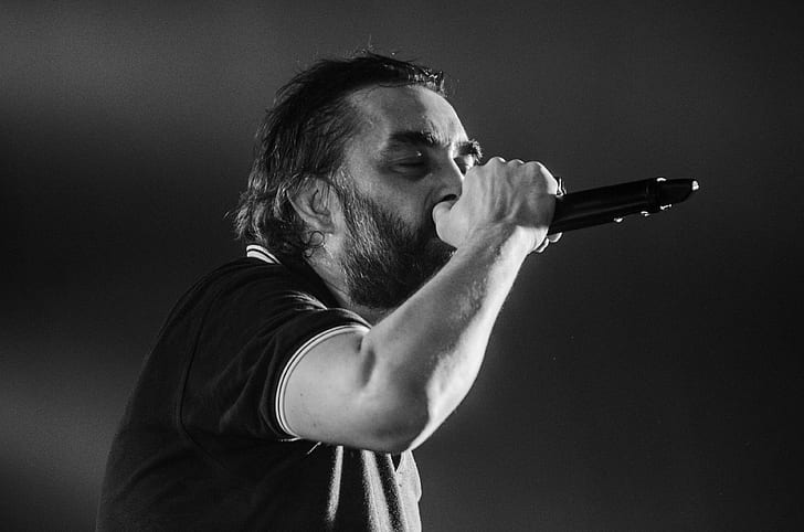 adult, beard, black and white, blur, boy, close up, concert, guy, male, man, microphone, monochrome, music, musician, performance, singer, singing, songwriter, vocalist, HD wallpaper