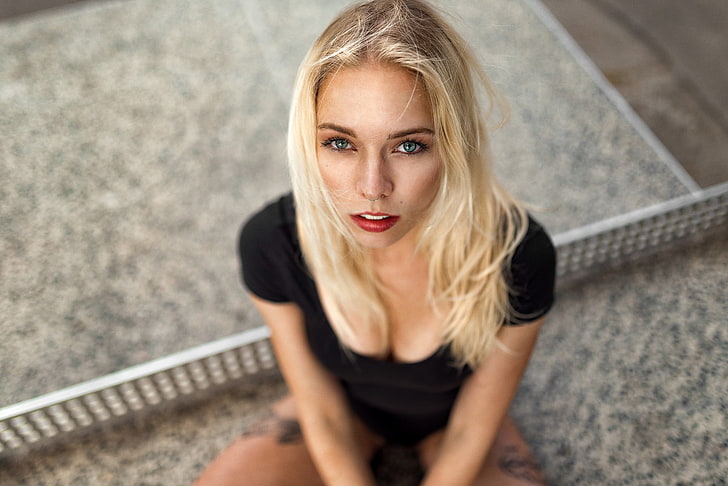 women's black scoop-neck top, women, blonde, face, blue eyes, depth of field, portrait, pierced nose, cleavage, black clothing, top view, tattoo, Miro Hofmann, looking at viewer, nose rings, red lipstick, long hair, HD wallpaper