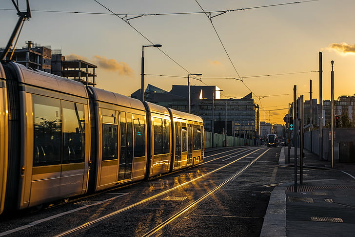 silver train during sunset, sunset, silver train, bounce, f1.4, canon fd, clouds, dublin, europe, geotagged, ireland, leading  light, lines, luas, sky, sony a7, tram, travel, urban, street photography, train, railroad Track, transportation, station, urban Scene, railroad Station Platform, mode of Transport, HD wallpaper