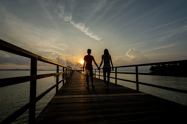 silhouette of man and woman holding hands walking on brown wooden dock during golden hour, with you, silhouette, man and woman, holding hands, walking on, dock, golden hour, Sunset, Resort, Sun, Clouds, Jetty, Blue  Light, Landscape, outdoors, sea, people, nature, women, beach, sky, bridge - Man Made Structure, two People, HD wallpaper