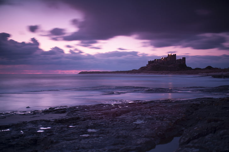 bamburgh, britain, castle, clouds, coast, england, evening, great, ocean, purple, sea, sky, HD wallpaper
