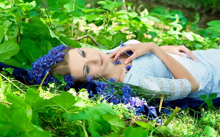 women, model, brunette, face, women outdoors, lying on back, nature, flowers, leaves, makeup, dress, sunlight, blue flowers, fantasy girl, grass, plants, HD wallpaper