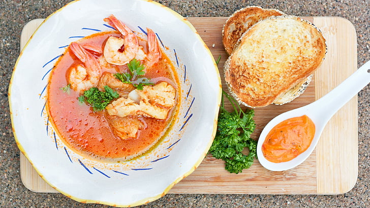 white and blue ceramic plate beside brown breads, seafood soup, shrimp, tomato sauce, greens, croutons, HD wallpaper
