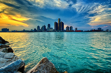 panoramic photo of building near body of water, detroit, detroit, Fireworks, panoramic photo, building, body of water, 55th, anniversary, bert weeks, memorial, gardens, city, crowds, detroit river, long exposure, nikon d600, ontario, park, rocks, skyline, ford, target, water, windsor  Canada, HDR, cloudy, day, urban Skyline, cityscape, sunset, skyscraper, architecture, sea, downtown District, urban Scene, reflection, famous Place, dusk, HD wallpaper HD wallpaper