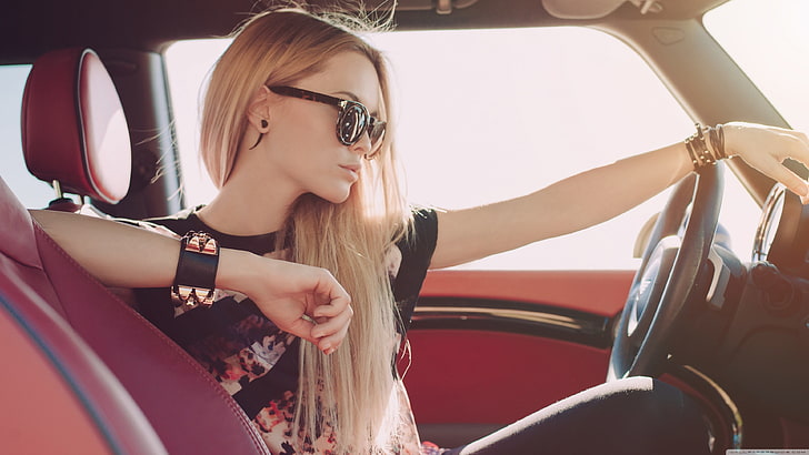 women's black and pink floral shirt, women, driving, car, brunette, blonde, model, long hair, sunglasses, car interior, women with glasses, T-shirt, piercing, face, red, HD wallpaper