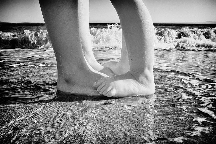 child stepping on mans foot on sea shore, Summertime, child, mans, foot, sea shore, Aegean  Sea, Sea  coast, close-up, waves, Küçükkuyu, black And White, women, sea, nature, people, females, human Leg, outdoors, water, HD wallpaper