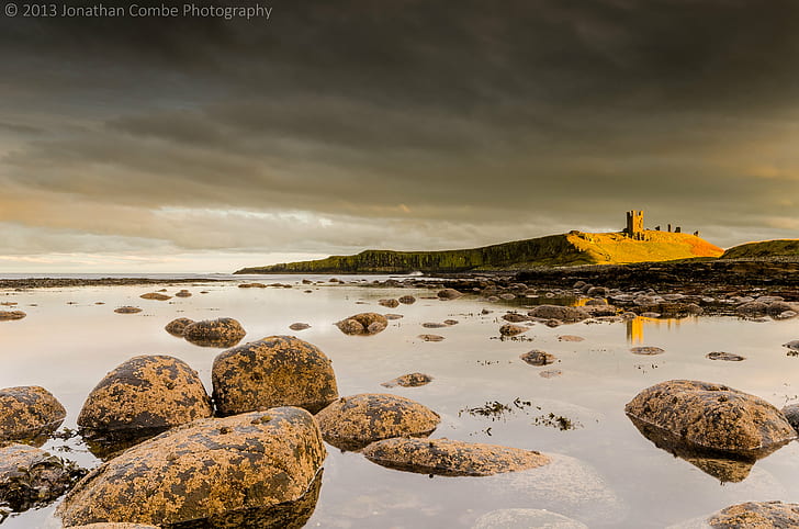 photo of brown stones on body of water, dunstanburgh, dunstanburgh, Dunstanburgh, Light, photo, body of water, water  Castle, Northumberland, sea  coast, reflection, rock, sky, clouds, Nikon-D7000, sea, sunset, coastline, rock - Object, beach, outdoors, landscape, dusk, nature, tower, scenics, famous Place, castle, HD wallpaper