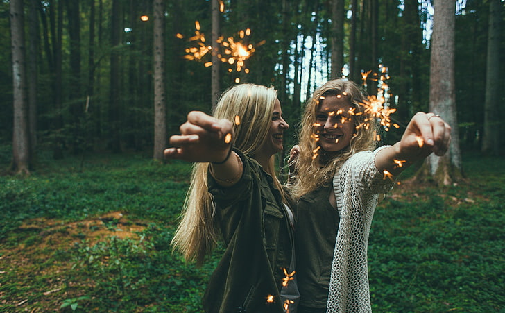 Sparklers Girls, women's two gray clothes and white cardigan, Holidays, New Year, Girls, People, Happy, Woman, Fireworks, Party, Forest, Young, Woods, Merry, Outdoors, Glow, Celebration, smiling, person, Joyful, sparkle, newyear, pyrotechnics, sparklers, cheerful, HD wallpaper