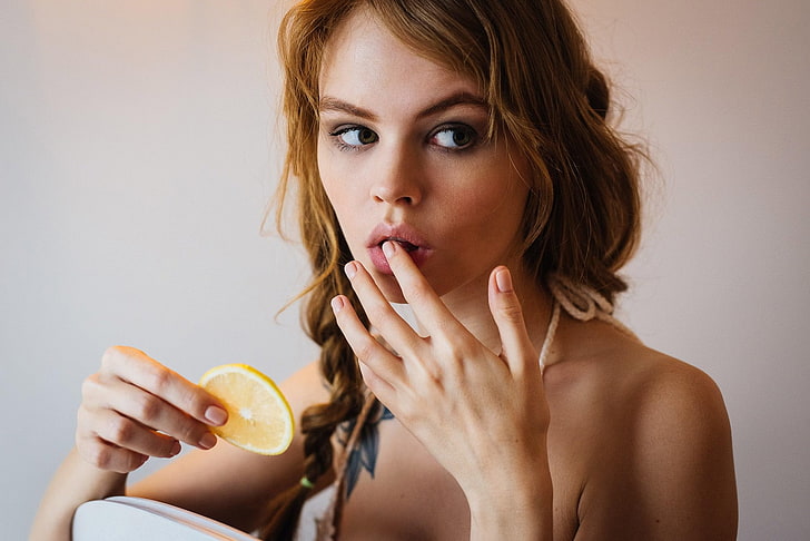 Anastasia Scheglova, women, blonde, pigtails, brunette, white stockings, lemons, chair, face, portrait, finger on lips, tattoo, pink nails, pink lipstick, looking away, finger in mouth, touching face, green eyes, HD wallpaper