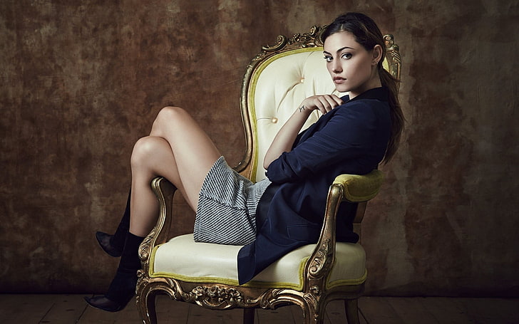 tufted white leather padded wooden armchair, Phoebe Tonkin, women, brunette, legs, legs crossed, skirt, jacket, ponytail, sitting, chair, boat, actress, long hair, looking at viewer, tattoo, HD wallpaper