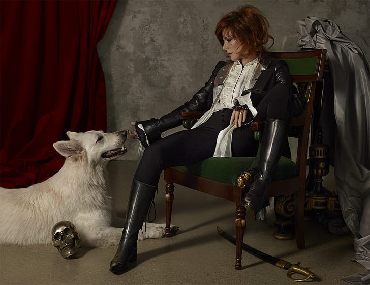 Mylène Farmer, French, singer, redhead, by the window, wolf, skull, sabre, boots, leather clothing, satin, HD wallpaper