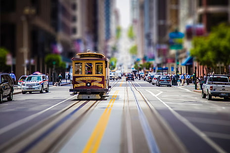 yellow and maroon tram, yellow tram traveling on road focus photography, street, car, road, city, tilt shift, cityscape, San Francisco, tram, blurred, building, HD wallpaper HD wallpaper