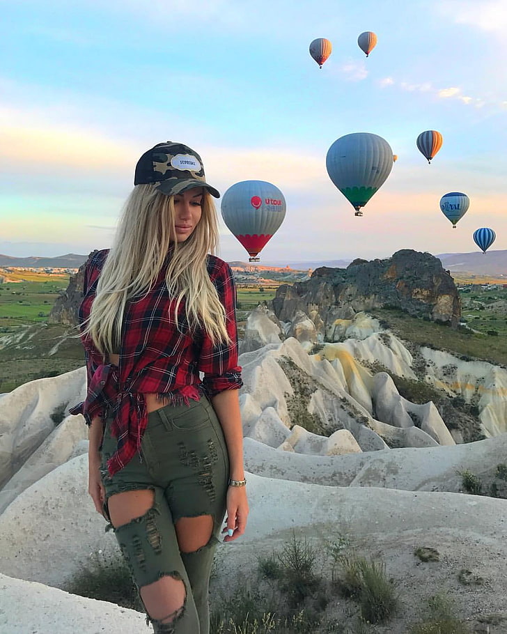 Anyuta Chernova, photography, women, women outdoors, Russian women, Russian Model, model, blonde, face, closed eyes, sky, clouds, jeans, hot air balloons, mountains, hat, plaid shirt, ripped clothes, ripped clothing, HD wallpaper
