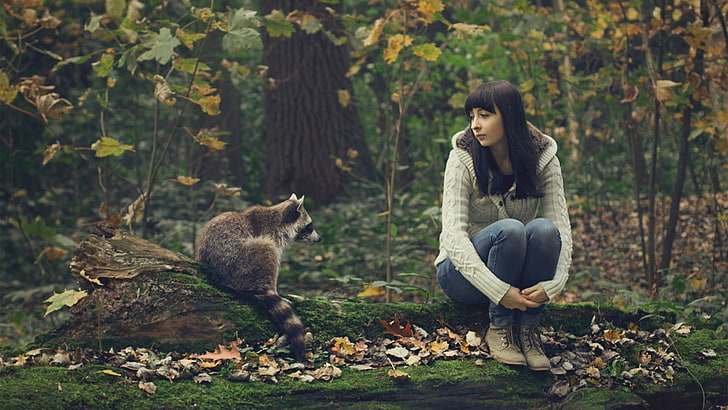 gray racoon, raccoons, log, women outdoors, sitting, holding knees, bangs, brunette, forest, leaves, HD wallpaper