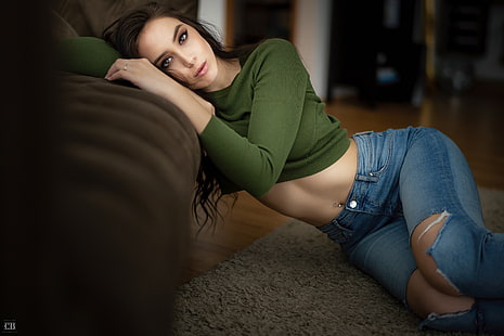 Anna Bous, women, brunette, model, long hair, looking at viewer, crop top, green top, sweater, jeans, torn jeans, belly, pierced navel, lying on side, on the floor, couch, depth of field, brown eyes, indoors, women indoors, portrait, Chris Bos, HD wallpaper HD wallpaper