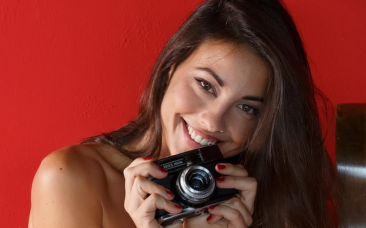 smiling, red background, camera, painted nails, face, Lorena Garcia, model, HD wallpaper