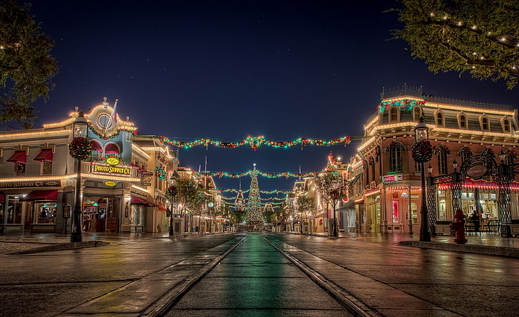 Christmas at Disneyland, photography of assorted-color string lights on buildings, Holidays, Christmas, California, Disneyland, HD wallpaper