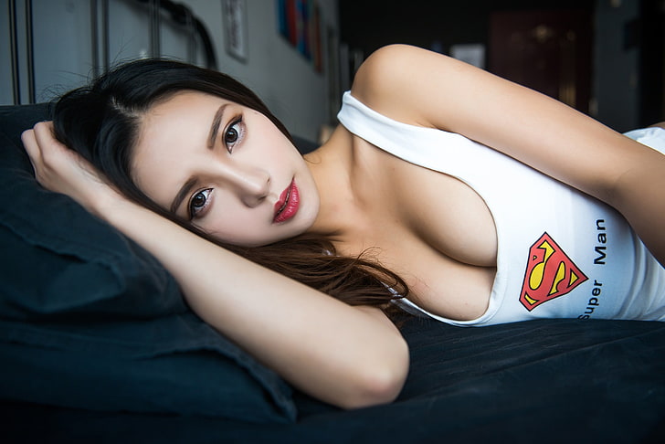 girl, logo, superman, cleavage, Asian, long hair, breast, photo, model, lips, face, brunette, chest, white top, portrait, in bed, mouth, tank top, lipstick, looking at camera, dark eyes, straight hair, bare shoulders, looking at viewer, lying on side, HD wallpaper