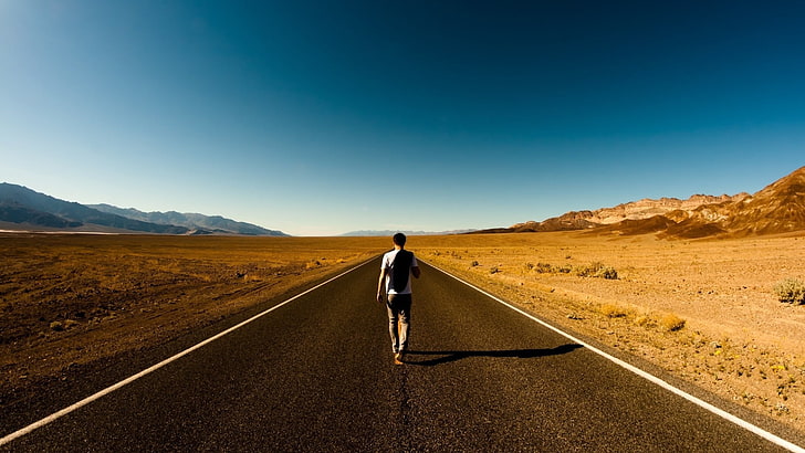 man walking on middle of road surrounded by desert, road, desert, walking, men, highway, HD wallpaper