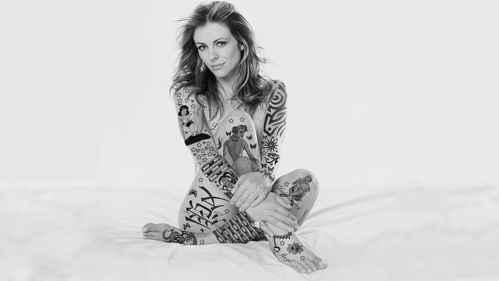 woman sitting on white surface wallpaper, Elizabeth Hurley, tattoo, women, feet, brunette, body paint, HD wallpaper
