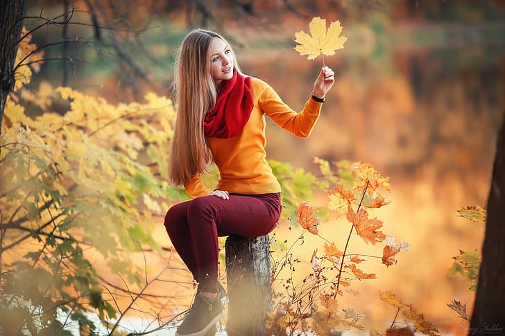 girl, forest, long hair, trees, photo, photographer, blue eyes, autumn, leaves, model, bokeh, lips, jeans, face, blonde, branch, scarf, fall, sitting, portrait, mouth, sneakers, sweater, depth of field, log, straight hair, looking away, Sergey Shatskov, HD wallpaper