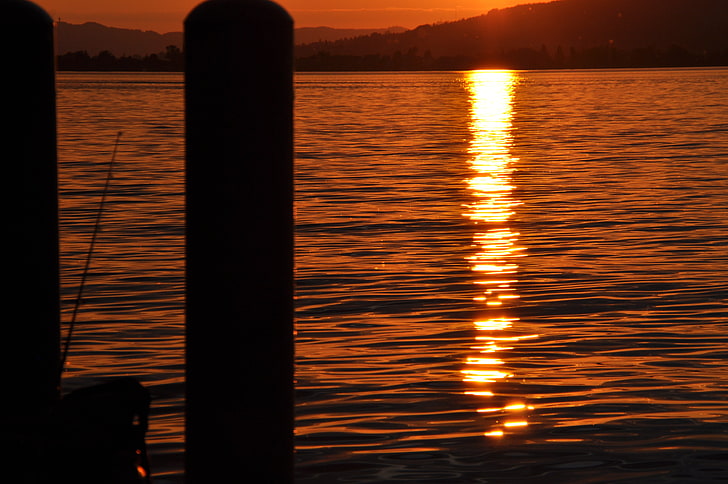 canna da pesca nera e spo d'acqua, tramonto, Svizzera, mare, Sfondo HD