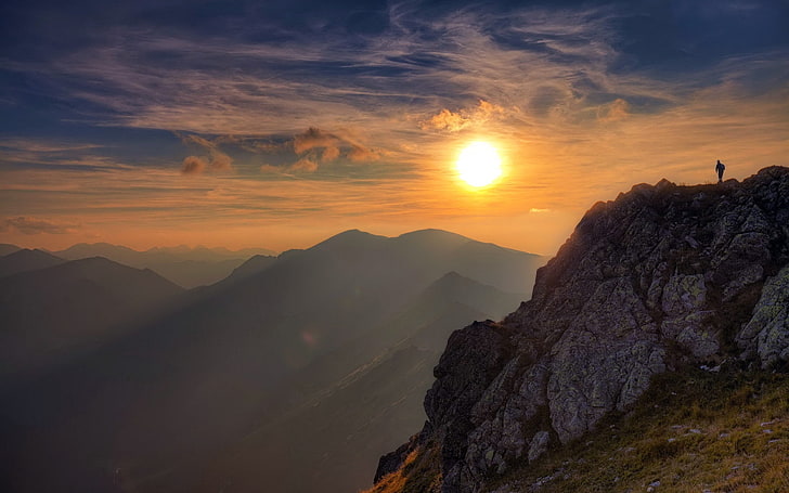 brown rock mountain, sun, light, rock, person, clouds, sky, height, climber, conquest, HD wallpaper