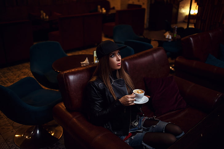 Sergey Sorokin, women, brunette, model, baseball caps, leather jackets, black jackets, belt, jeans, torn jeans, ripped clothes, pantyhose, sitting, couch, bokeh, coffee cup, coffee, looking up, indoors, women indoors, portrait, HD wallpaper