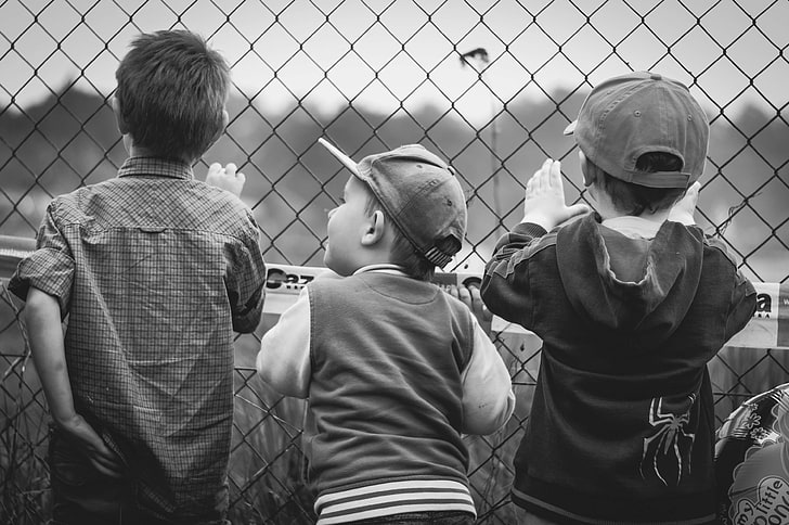 Black and white, boys, children, curiosity, facial expression, fence,  friends, HD wallpaper | Wallpaperbetter