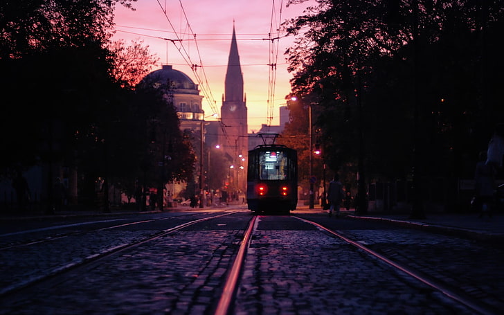 black tram, photo of tram during golden hour, cityscape, Poland, Poznan, church, tram, city, street, university, photography, dusk, urban, railway, Polish, HD wallpaper