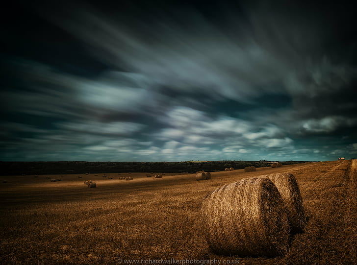 two brown hay bales, brown, hay, clouds, crop, long exposure, wheat, bale, agriculture, nature, rural Scene, field, farm, landscape, summer, sky, harvesting, landscaped, outdoors, yellow, land, gold Colored, scenics, cloud - Sky, straw, meadow, non-Urban Scene, autumn, blue, growth, cereal Plant, no People, HD wallpaper