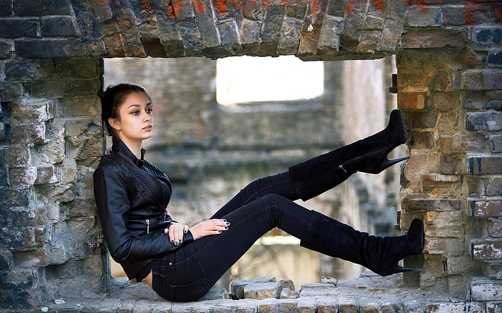 women's black full-zip jacket, women, brunette, brown eyes, leather jackets, knee-high boots, sitting, side view, looking into the distance, black nails, jeans, black jackets, black boots, Hands on legs, women outdoors, HD wallpaper