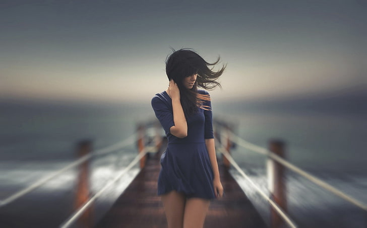 women's black mini dress, timelapse photograph of woman walking on dock, wind, women, women outdoors, blue dress, dress, pier, HD wallpaper
