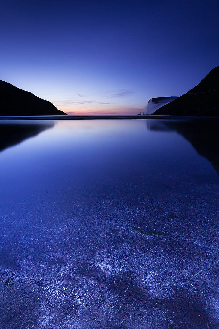 body of water between mountain ridges during night, Tjørnuvík, body of water, mountain, ridges, faroe islands, long exposure, blue  night, beach  sand, horizon, sunset, accepted, clear, evening, tag, nature, lake, landscape, blue, water, sky, scenics, reflection, outdoors, tranquil Scene, sea, HD wallpaper
