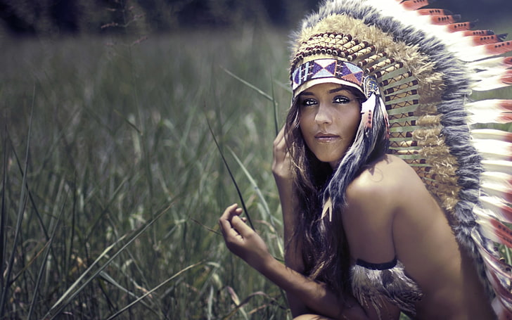 gray and white feather headdress, brunette, headdress, nature, women, long hair, women outdoors, looking at viewer, feathers, field, grass, bare shoulders, face, topless, strategic covering, model, HD wallpaper