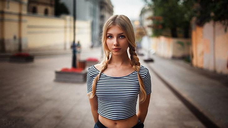 women's white and black striped top, selective focus photography of woman standing on street, Alice Tarasenko, women, blonde, pigtails, depth of field, braids, belly button, belly, crop top, bare midriff, HD wallpaper