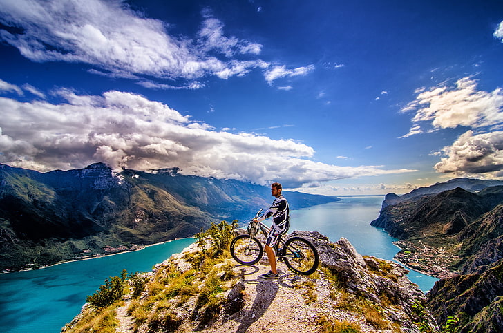 men's black and white top, the sky, clouds, mountains, the city, rider, peak, solar, mountain bike, the fjord, extreme sports, HD wallpaper