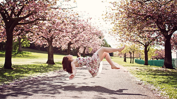 women's white and pink floral strapless dress, women, model, brunette, long hair, flying, floating, women outdoors, trees, road, dress, shadow, magic, grass, park, closed eyes, barefoot, bare shoulders, open mouth, blossoms, Asian, cherry blossom, photography, Photoshop, HD wallpaper