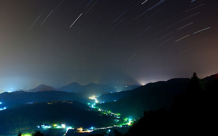 black mountain, timelapse photography of star, stars, hills, cityscape, lights, green, blue, shooting stars, star trails, valley, HD wallpaper