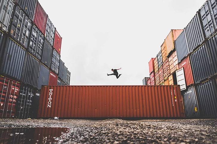 business, commerce, container, export, dom, industry, jumping, jumpshot, low angle shot, man, outdoors, person, photoshoot, pose, posing, puddle, rocks, shipment, steel, warehouse, wet, HD wallpaper