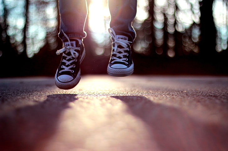 pair of black Converse All-Star low-tops, jumping, shoes, sunlight, legs, bokeh, HD wallpaper