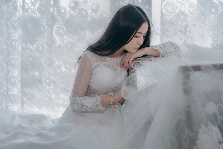 chest, look, girl, face, pose, style, white, portrait, hands, brunette, window, fabric, curtains, bracelet, lace, Asian, sitting, light background, the bride, young, wedding dress, tulle, long-haired, leaning, luxury, sad, head down, HD wallpaper